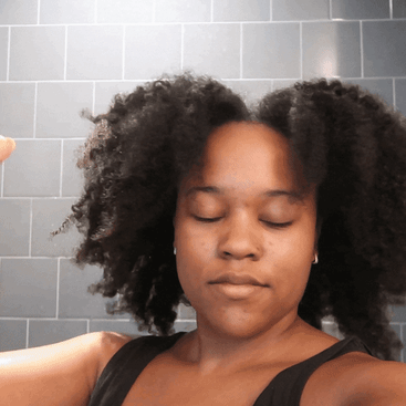 video of continuous spray bottle on natural hair